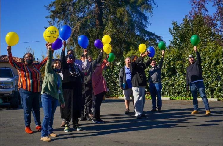 participants in the Suvivors of Suicide Loss Day holding up their balloons