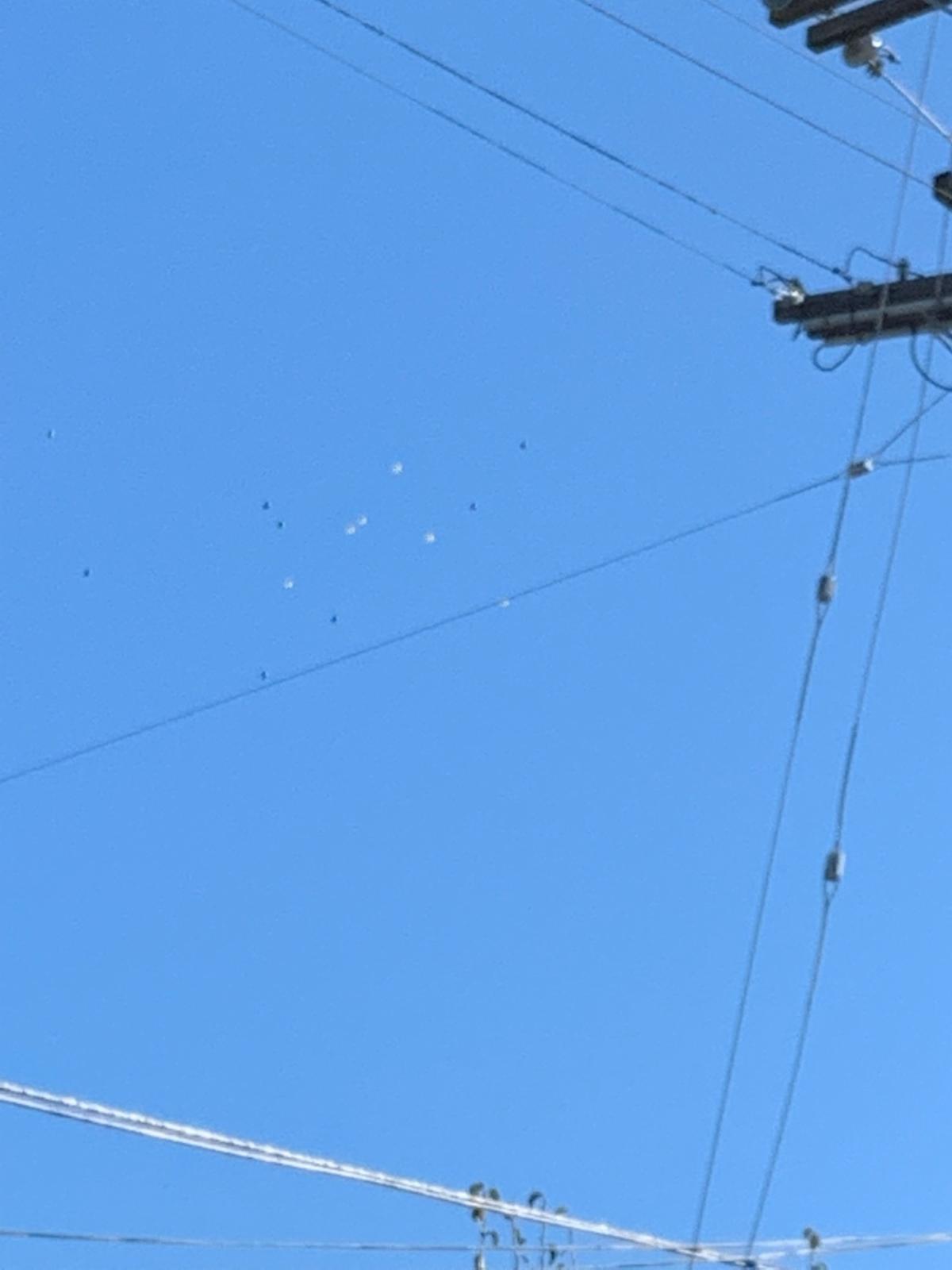 balloons floating away